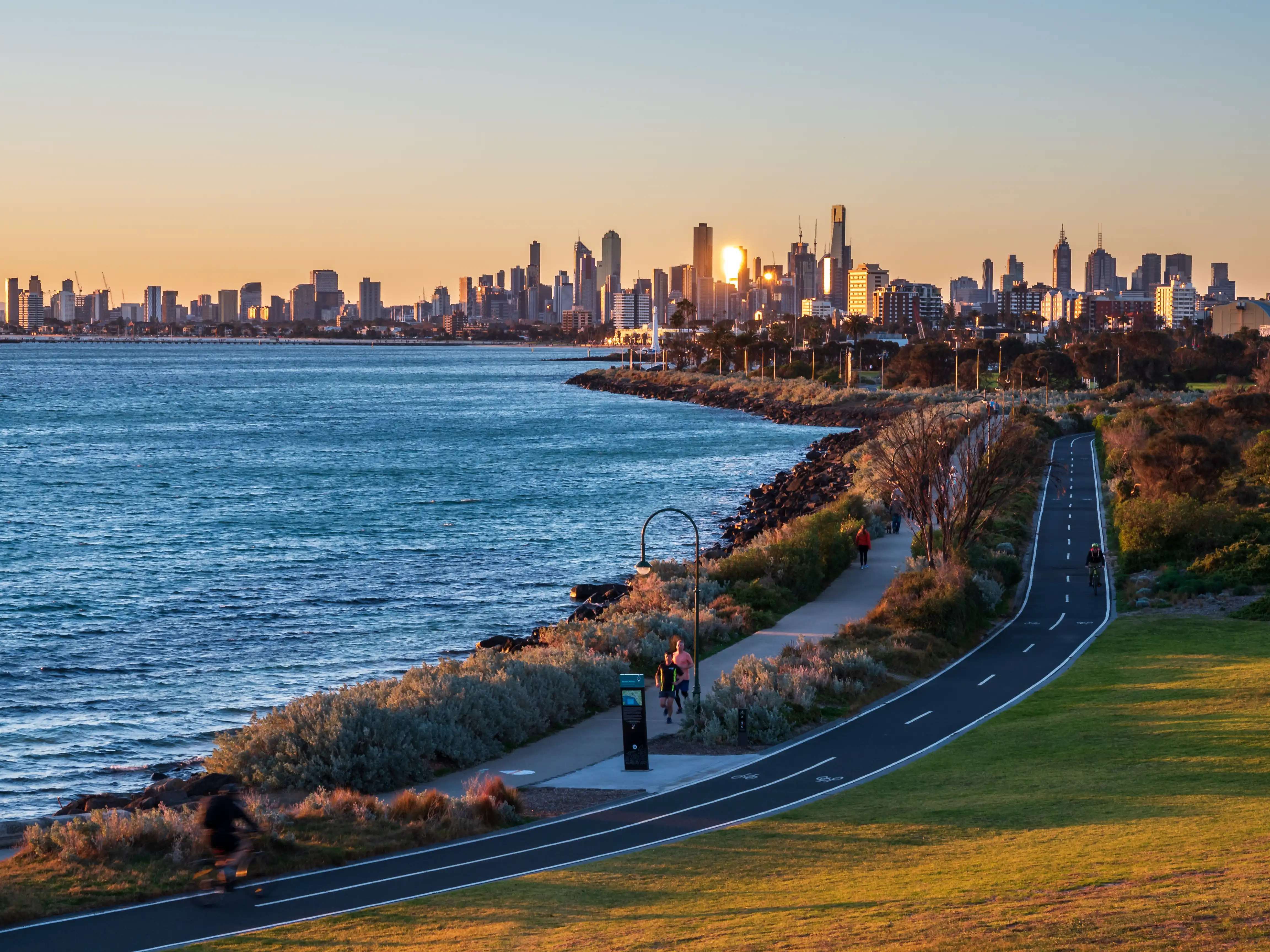 Melbourne skyline at golden hour, welcoming newcomers with HelloCity